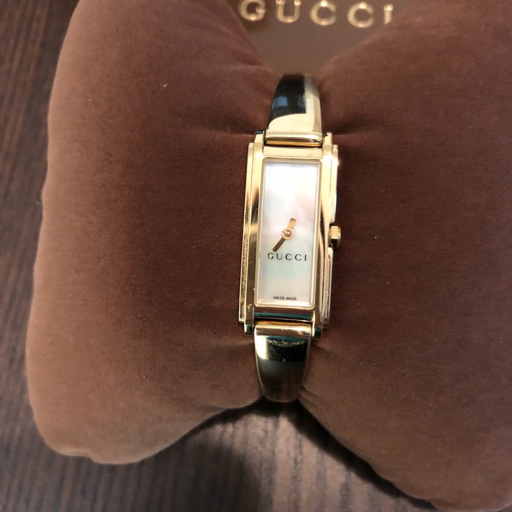 Gucci gold plated watch.